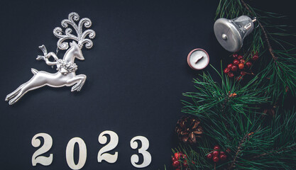 Fototapeta na wymiar Christmas background with numbers 2023 and decor details, flat lay.