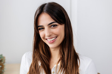 Beautiful woman with brown hair at home
