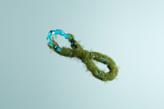 Three dimensional render of infinity symbol made of grass and water