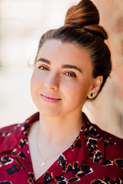 Portrait of smiling woman with bun