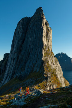 Mature couple hiking on Segla mountain