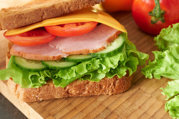 Close-up of the sandwich, side view. Culinary photo wallpaper.