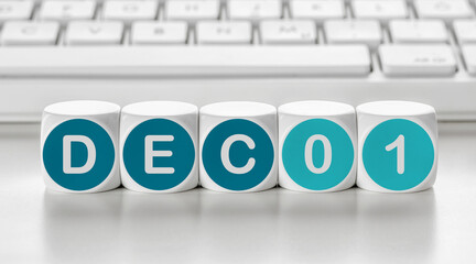 Letter dice in front of a keyboard - December 01