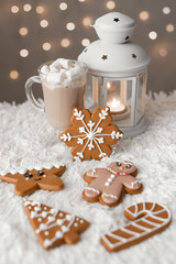 Vertical photo of christmas festive sweets: food and drink. Winter holiday decor at home. Gingerbread cookies with cup of hot cocoa.