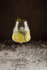 Transparent cocktail with lime and ice