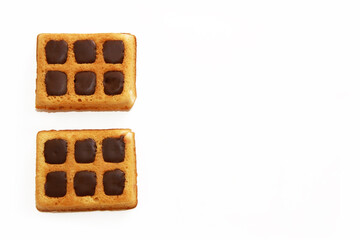 baked sweet Viennese waffles with chocolate filling on a white background