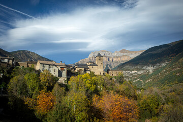 Obraz premium Scenic landscape with Orla Church in the center and mountains of Ordesa y Monte Perdido National Park, Spain, in the background