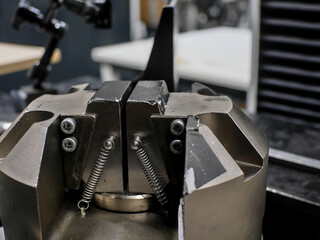 Close-up on traction machine jaws, for mechanical tests.