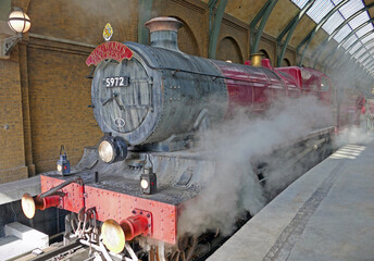Fototapeta premium Hogwarts Express in Universal Studios on platform just before leaving