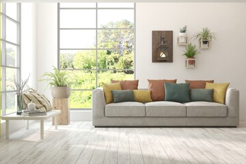 White living room with sofa and summer landscape in window. Scandinavian interior design. 3D illustration