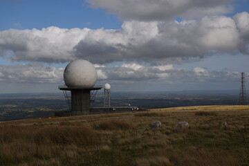 a view of the radar station at Titterstone Clee summit with the sky clear blue