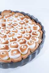 Lemon meringue cake tart portion white plate elegant