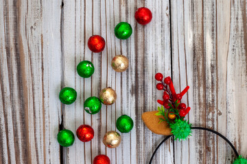 Naklejka na ściany i meble Christmas chocolate balls and reindeer antlers for rustic fun filled Christmas