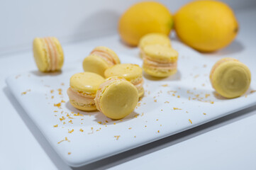 Lemon yellow macarons, white dish, french dessert