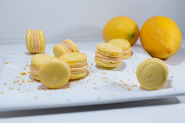 Lemon yellow macarons, white dish, french dessert