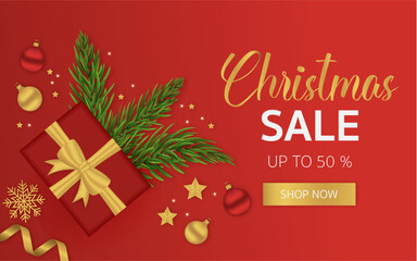 Fototapeta na wymiar Red Christmas sale banner with Christmas toys and fir twigs. The horizontal banner is great for cards, brochures, flyers, and advertising poster templates. Vector illustration.