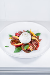 burrata tomato peach fruit salad circle white elegant dish basil
