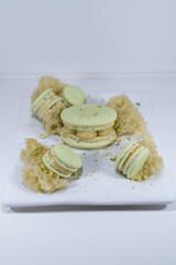Green pistachio macarons, sponge cake mousse cake, french dessert