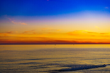 Fototapeta premium Sky at sunset over sea