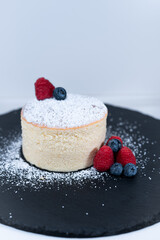 japanese cheese cake blueberry raspberry black plate sugar powder
