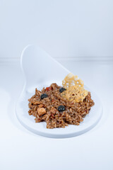 yellow paella risotto balck pearls parmessan cheese elegant dish