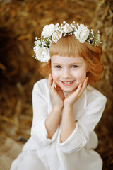 portrait of a beautiful little girl in a field