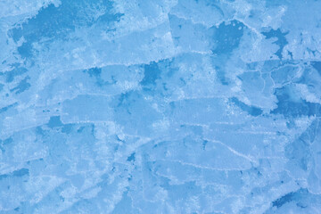 Texture of winter ice surface. Blue natural ice background