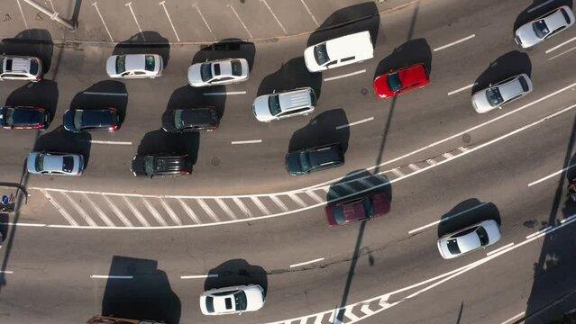 Aerial top view of vehicle traffic on a motorway. Moderate car traffic.