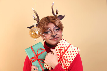 Cute christmas reindeer makeup look surrounded by Christmas elements