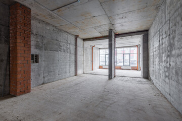 Empty concrete commercial space without finishing with partitions