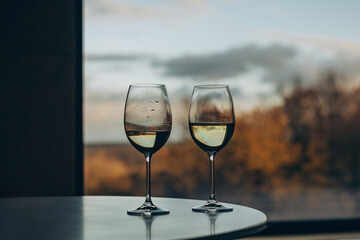 Two glasses against the background of an autumn landscape