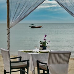Set up for a romantic private dinner on the sandy beach