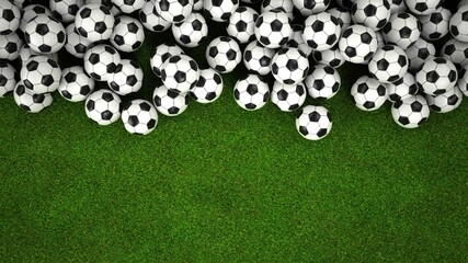 Klassische Fußbälle auf einem grünen Rasen, Draufsicht © Alexander Limbach