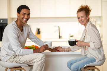Happy young couple spending time at home