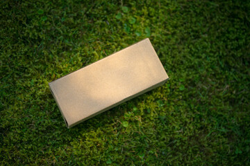 Rectangular craft box on a green background. Online parcel delivery. The box is rectangular in shape.