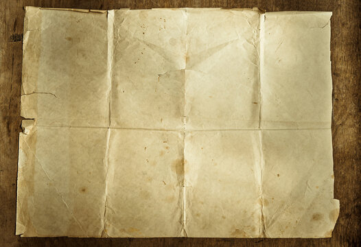Old brown paper.A photo of a clean antique sheet on a wooden table. Vintage manuscript.
