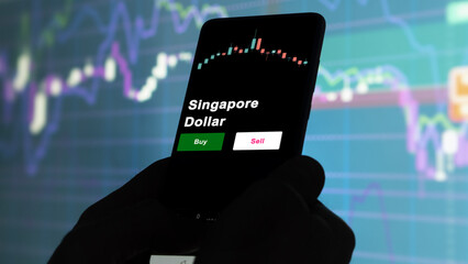 An investor's analyzing the Singapore Dollar etf fund on screen. A phone shows the ETF's prices megaCap to invest