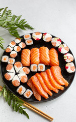 Beautiful festive set of sushi and rolls with salmon