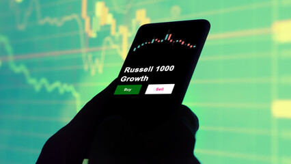 An investor's analyzing the Russell 1000 Growth etf fund on screen. A phone shows the ETF's prices...