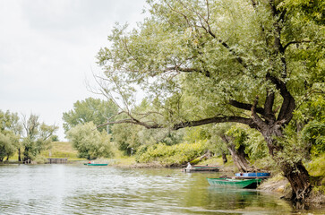 Wooden fishing boats tied to the shore.