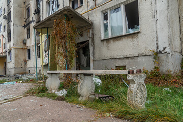 War in Ukraine. 2022 Russian invasion of Ukraine. Entrance of an apartment building destroyed by...