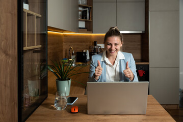 Young freelancer woman sitting at home with laptop having online job interview while she wearing formal wear talking to employee manager human resource people on video call web conference on computer.