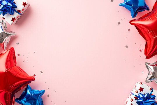 Forth of July celebration concept. Top view photo of star shaped balloons in national flag colors present boxes and shiny confetti on isolated pastel pink background with copyspace