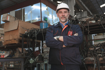 Caucasian engineer working with with spares at factory spares
