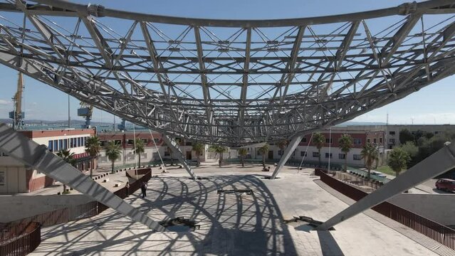 Rising aerial of framework for Veliera sail shade over public square