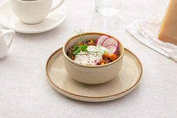 Portion of buckwheat porridge with sour cream and mushrooms