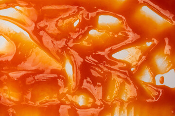 Red sauce splashes as background.