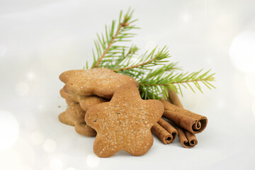 Ginger cookies asterisk with sugar, cinnamon on a white blurred background. Christmas Gift