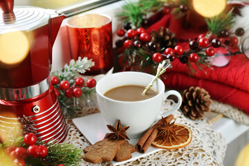 Christmas coffee on windowsill with festive decorations