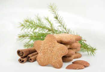 Ginger cookies asterisk with sugar, cinnamon on a white blurred background. Christmas Gift